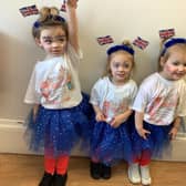 Youngsters at Nurserytime celebrate the coronation.