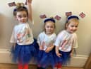 Youngsters at Nurserytime celebrate the coronation.