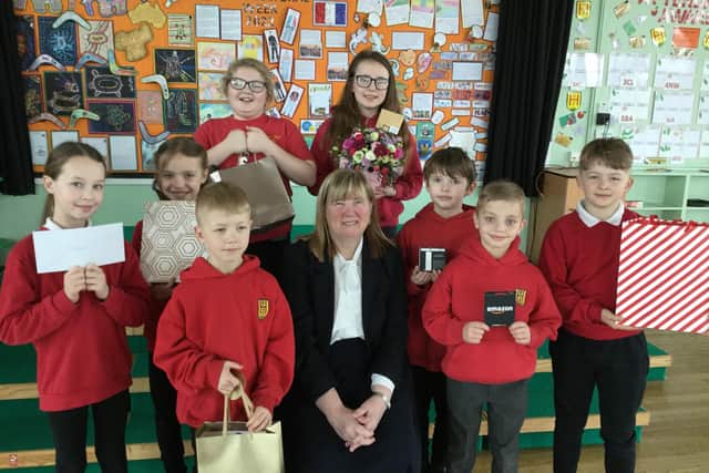 Ann Robinson with pupils from Biddick Hall Junior School.
