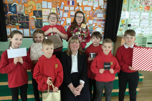 Ann Robinson with pupils from Biddick Hall Junior School.