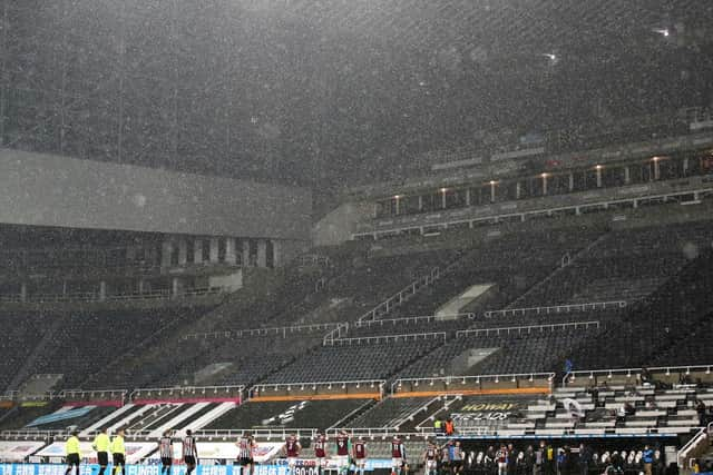 A general view as players walk off the pitch in the rain during the Premier League match between Newcastle United and Burnley at St. James Park on October 03, 2020 in Newcastle upon Tyne, England.