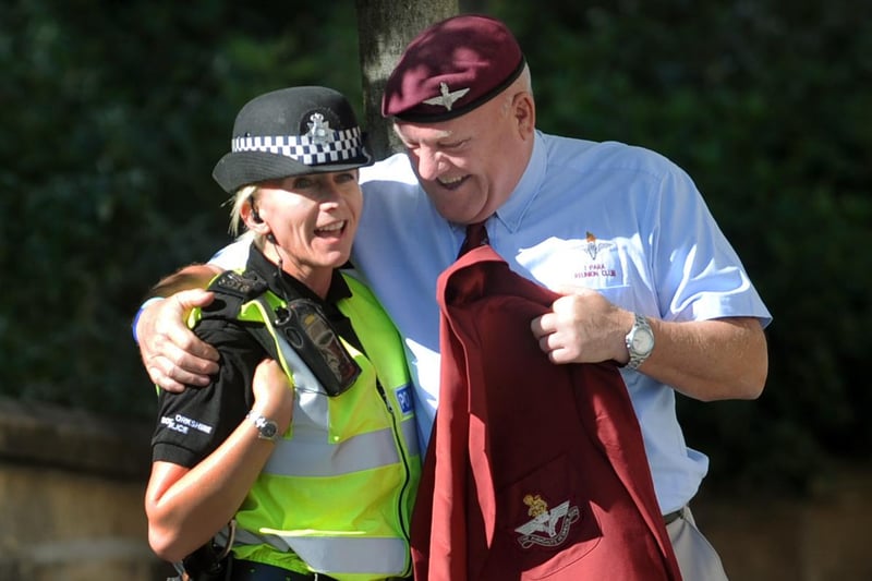 Battle of Britain and Battle of Arnhem Parade and Service Sheffield City Centre in 2009 where a past member of the armed services gives an hug to a South Police Sergant before the March outside the City Hall
