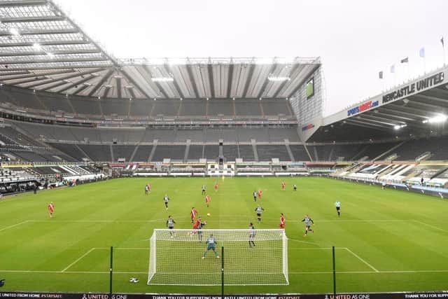 A general view of the action infront of empty seats during the Premier League match between Newcastle United and Southampton at St. James Park on February 06, 2021 in Newcastle upon Tyne, England. Sporting stadiums around the UK remain under strict restrictions due to the Coronavirus Pandemic as Government social distancing laws prohibit fans inside venues resulting in games being played behind closed doors. (Photo by Stu Forster/Getty Images)