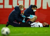 HEVERLEE, BELGIUM - NOVEMBER 15: Ben Chilwell of England receives medical treatment during the UEFA Nations League group stage match between Belgium and England at King Power at Den Dreef Stadion on November 15, 2020 in Heverlee, Belgium. Football Stadiums around Europe remain empty due to the Coronavirus Pandemic as Government social distancing laws prohibit fans inside venues resulting in fixtures being played behind closed doors. (Photo by Dean Mouhtaropoulos/Getty Images)