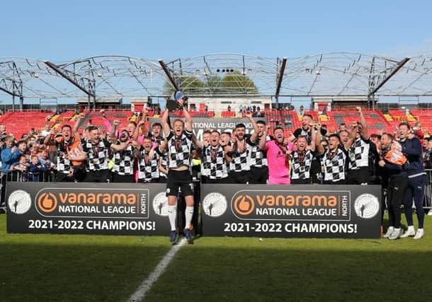 Gateshead captain Greg Olley lifts the National League North League title (photo: Charles Waugh).
