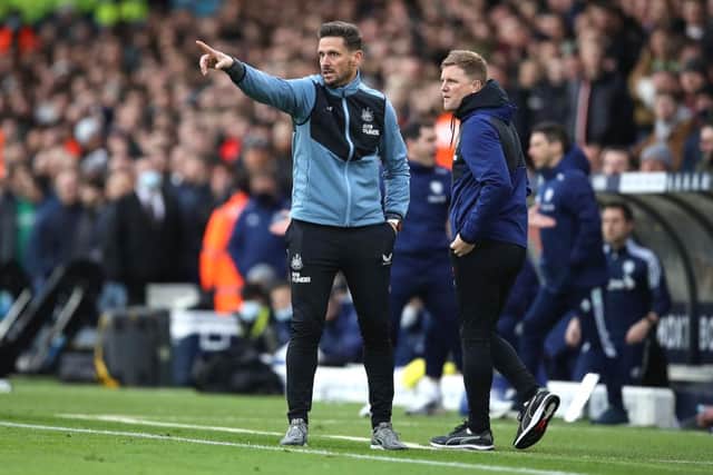 LEEDS, ENGLAND - JANUARY 22: Assistant Manager of Newcastle United, Jason Tindall (L) gives instructions as Eddie Howe, Manager of Newcastle United looks on during the Premier League match between Leeds United  and  Newcastle United at Elland Road on January 22, 2022 in Leeds, England. (Photo by George Wood/Getty Images)