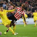 Virgil van Dijk of Liverpool tangles with Ivan Toney of Brentford. (Photo by Justin Setterfield/Getty Images)