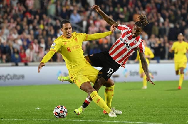 Virgil van Dijk of Liverpool tangles with Ivan Toney of Brentford. (Photo by Justin Setterfield/Getty Images)