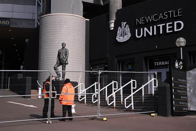 General view outside the stadium as stewards speak inside temporary fencing, prior to the Premier League match between Newcastle United and West Ham United at St. James Park on April 17, 2021 in Newcastle upon Tyne, England.