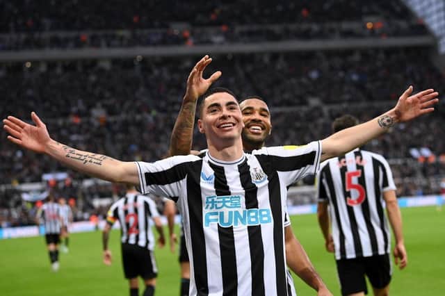 Miguel Almiron of Newcastle United celebrates after scoring their side's fourth goal with Callum Wilson during the Premier League match between Newcastle United and Aston Villa at St. James Park on October 29, 2022 in Newcastle upon Tyne, England. (Photo by Stu Forster/Getty Images)