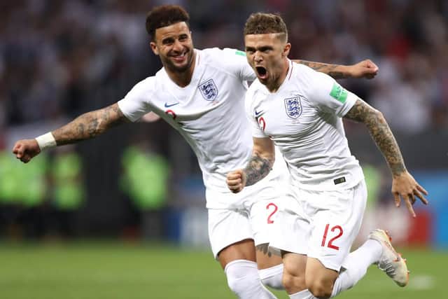 Kieran Trippier of England celebrates with team mate Kyle Walker after scoring his team's first goal during the 2018 FIFA World Cup Russia Semi Final match between England and Croatia at Luzhniki Stadium on July 11, 2018 in Moscow, Russia. (Photo by Ryan Pierse/Getty Images)