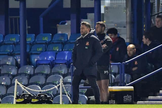 Lee Johnson watches his side produce a superb performance at Fratton Park