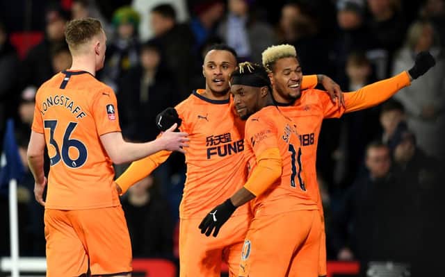 WEST BROMWICH, ENGLAND - MARCH 03: Valentino Lazaro of Newcastle United celebrates with team mates Joelinton and Allan Saint-Maximin  after scoring his sides third goal during the FA Cup Fifth Round match between West Bromwich Albion and Newcastle United at The Hawthorns on March 03, 2020 in West Bromwich, England. (Photo by Stu Forster/Getty Images)