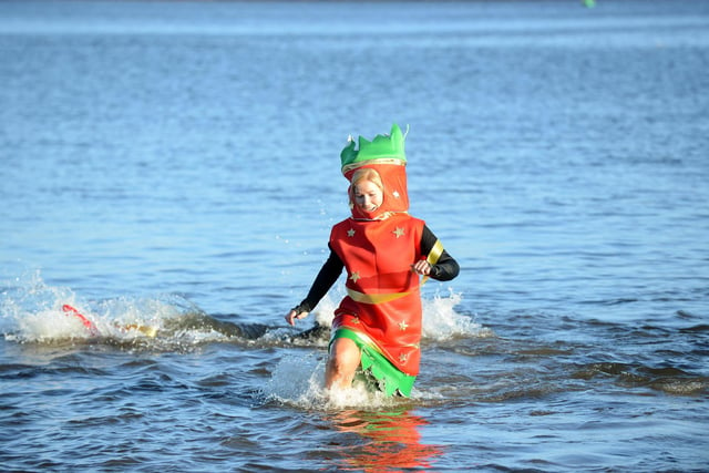 Fundraiser enjoying the dip as a Christmas cracker at Littlehaven beach