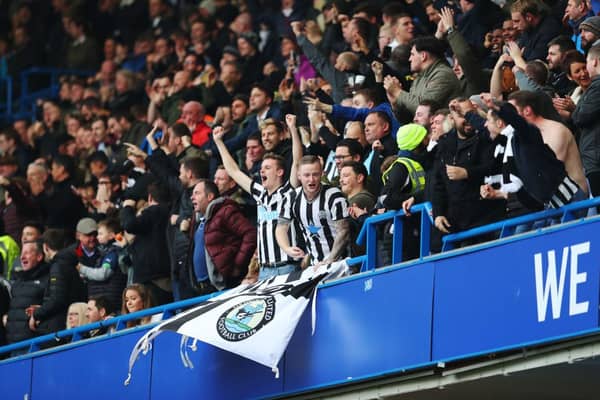 Newcastle United fans celebrate their sides first goal during the Premier League match between Chelsea and Newcastle United at Stamford Bridge on December 2, 2017 in London, England.  (Photo by Catherine Ivill/Getty Images)