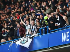 Newcastle United fans celebrate their sides first goal during the Premier League match between Chelsea and Newcastle United at Stamford Bridge on December 2, 2017 in London, England.  (Photo by Catherine Ivill/Getty Images)