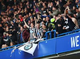 Newcastle United fans celebrate their sides first goal during the Premier League match between Chelsea and Newcastle United at Stamford Bridge on December 2, 2017 in London, England.  (Photo by Catherine Ivill/Getty Images)