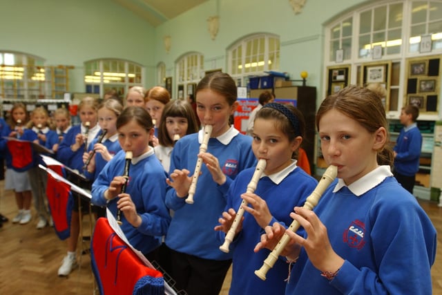 Pupils showing their musical talents in July 2004.