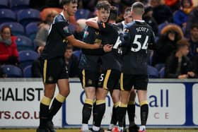 Joe White (2L) celebrates with his teammates Cameron Ferguson (L), Ryan Barrett (3L) and Joshua Scott (R) of Newcastle United after scoring his team's second goal  during the Papa John's EFL Trophy Group match between Mansfield  Town and Newcastle United U21 Photo by Laurence Griffiths/Getty Images)