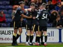 Joe White (2L) celebrates with his teammates Cameron Ferguson (L), Ryan Barrett (3L) and Joshua Scott (R) of Newcastle United after scoring his team's second goal  during the Papa John's EFL Trophy Group match between Mansfield  Town and Newcastle United U21 Photo by Laurence Griffiths/Getty Images)