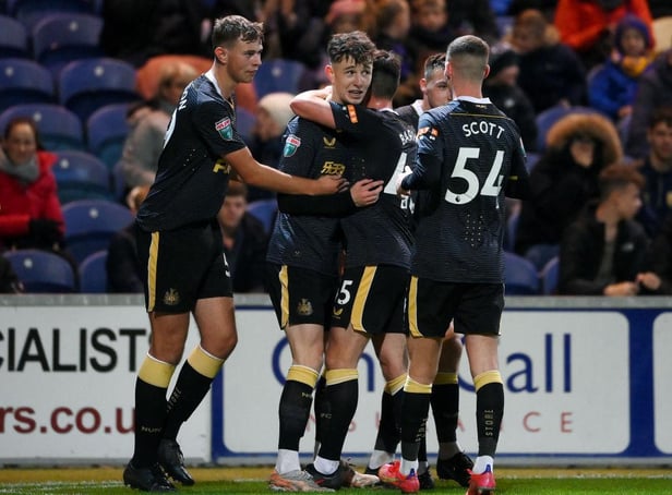 Joe White (2L) celebrates with his teammates Cameron Ferguson (L), Ryan Barrett (3L) and Joshua Scott (R) of Newcastle United after scoring his team's second goal  during the Papa John's EFL Trophy Group match between Mansfield  Town and Newcastle United U21 Photo by Laurence Griffiths/Getty Images)