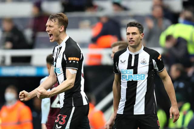 Dan Burn of Newcastle United celebrates their sides victory after the Premier League match between Newcastle United and Aston Villa at St. James Park on February 13, 2022 in Newcastle upon Tyne, England. (Photo by George Wood/Getty Images)