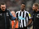 Newcastle United's Alexander Isak is helped off the field.