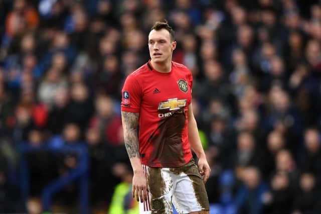 Phil Jones of Manchester United covered in mud during the FA Cup Fourth Round match between Tranmere Rovers and Manchester United. (Photo by Gareth Copley/Getty Images)