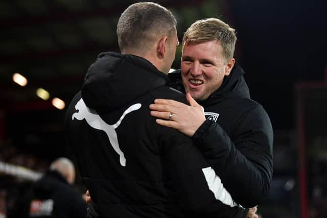 Graeme Jones embraces Bournemouth manager Eddie Howe last year.