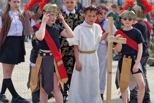 Pupils from St Cuthbert's take their performance to the streets.