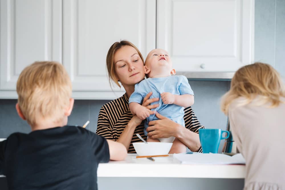 A mother with three children, who would be impacted by the two-child limit. Photo posed by models