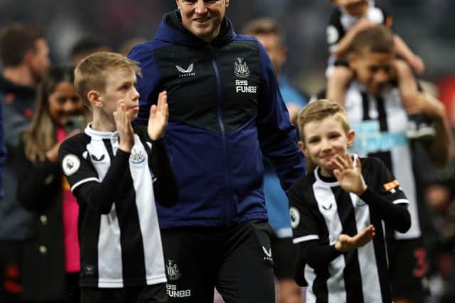 Newcastle United head coach Eddie Howe with two of his boys after last season's win over Arsenal.