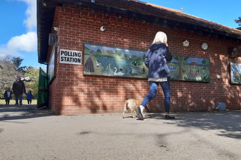 A voter and her dog on her way into the polling station at Ward Jackson Park.