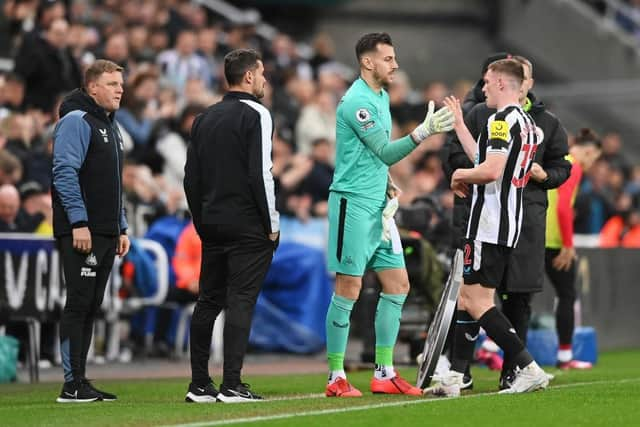 Martin Dubravka of Newcastle United is substituted on for teammate Elliot Anderson as Eddie Howe, Manager of Newcastle United, looks on during the Premier League match between Newcastle United and Liverpool FC at St. James Park on February 18, 2023 in Newcastle upon Tyne, England. (Photo by Stu Forster/Getty Images)