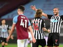 Newcastle United's English striker Andy Carroll (R) reacts after Newcastle United's Irish midfielder Jeff Hendrick (C) scored their second goal during the English Premier League football match between West Ham United and Newcastle United at The London Stadium, in east London on September 12, 2020.