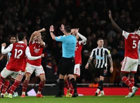 Arsenal players appeal to Referee Andy Madley during the English Premier League football match between Arsenal and Newcastle United at the Emirates Stadium in London on January 3, 2023. (Photo by BEN STANSALL/AFP via Getty Images)