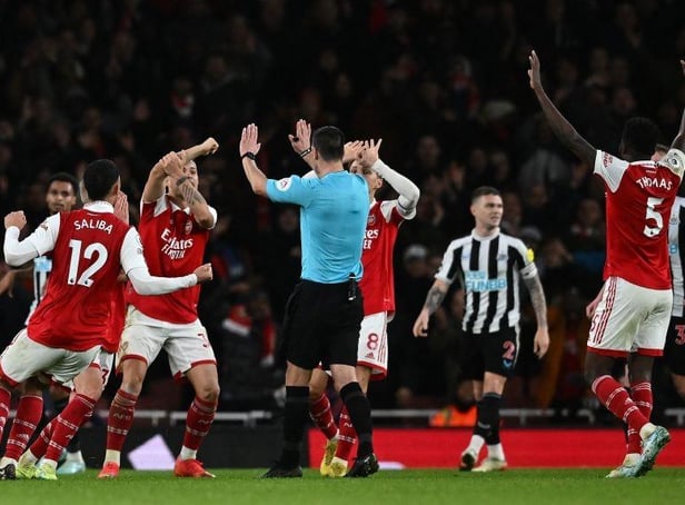 Arsenal players appeal to Referee Andy Madley during the English Premier League football match between Arsenal and Newcastle United at the Emirates Stadium in London on January 3, 2023. (Photo by BEN STANSALL/AFP via Getty Images)
