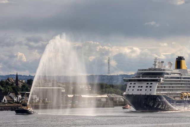 The Spirit of Adventure leaves the River Tyne, with a tug water display to mark the occasion