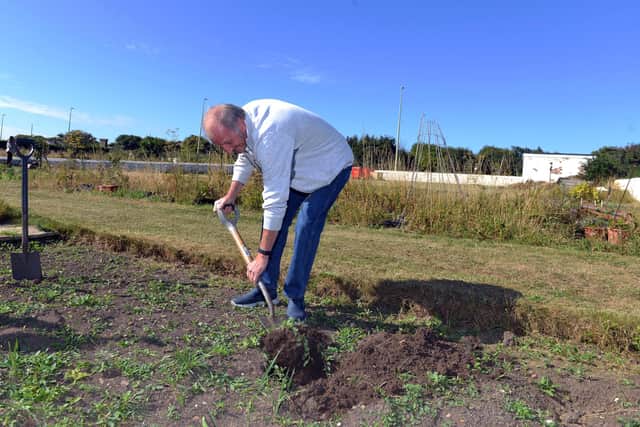 Volunteer Les Allon gets stuck in to some work at the Souter Lighthouse allotment mental health initiative open day.