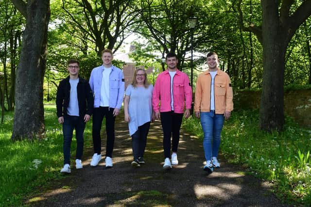 Angie Angus (centre) of Mental Health Concern, with four lads who have raised over £3000 for the charity, l-r Ethan Proud,Ben Robson, Nathan Johnson and Matthew Foster.