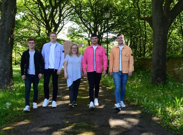 Angie Angus (centre) of Mental Health Concern, with four lads who have raised over £3000 for the charity, l-r Ethan Proud,Ben Robson, Nathan Johnson and Matthew Foster.