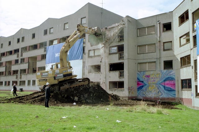 A bulldozer starts the demolition of flats at Granton, August 1992.