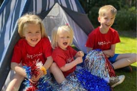 Esme, Bronte and Oscar McPherson get into the spirit of the VE Day activities.