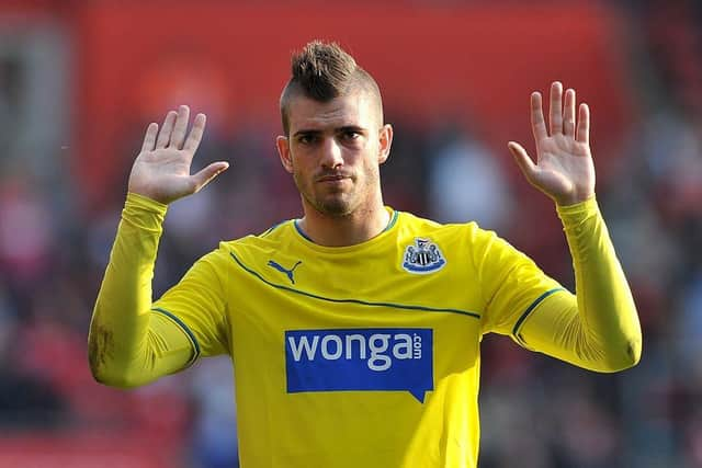 Newcastle United's Italian defender Davide Santon gestures to their fans after losing the English Premier League football match between Southampton and Newcastle United at St Mary's Stadium in Southampton, southern England on March 29, 2014. Southampton won 4-0. AFP PHOTO / GLYN KIRK