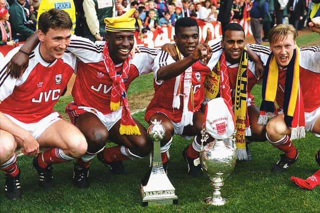 LONDON, UNITED KINGDOM - MAY 11: Arsenal players from left to right, Andy Linighan, Kevin Campbell, Paul Davis, David Rocastle and Lee Dixon  celebrate after securing the League Division One Championship by winning the League Division One match against Coventry City at Highbury on May 11, 1991 in London, England.  (Photo by Ben Radford/Allsport/Getty Images)