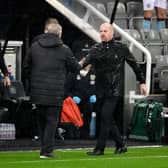 Steve Bruce, Manager of Newcastle United shakes hands with Sean Dyche, Manager of Burnley following the Premier League match between Newcastle United and Burnley at St. James Park. (Photo by Peter Powell - Pool/Getty Images)