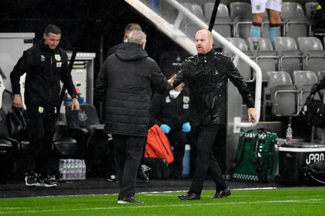 Steve Bruce, Manager of Newcastle United shakes hands with Sean Dyche, Manager of Burnley following the Premier League match between Newcastle United and Burnley at St. James Park. (Photo by Peter Powell - Pool/Getty Images)