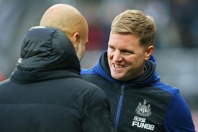 Newcastle United head coach Eddie Howe with Manchester City manager Pep Guardiola at St James's Park last December.