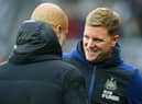 Newcastle United head coach Eddie Howe with Manchester City manager Pep Guardiola at St James's Park last December.