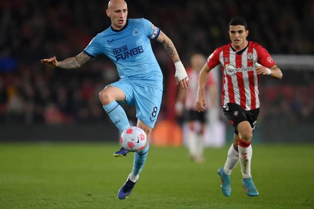 Jonjo Shelvey of Newcastle United dribbles with the ball  during the Premier League match between Southampton and Newcastle United at St Mary's Stadium on March 10, 2022 in Southampton, England.  (Photo by Mike Hewitt/Getty Images)